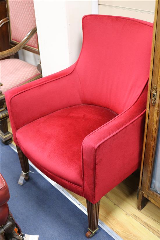 A pair of late 19th century/ early 20th century armchairs on fluted square legs